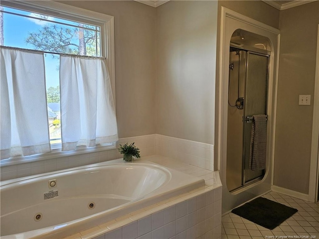 full bathroom with a shower stall, tile patterned flooring, a tub with jets, and ornamental molding