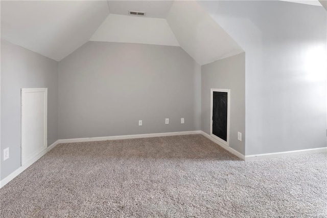 bonus room with lofted ceiling, carpet flooring, and baseboards