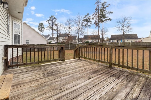 wooden terrace with a residential view