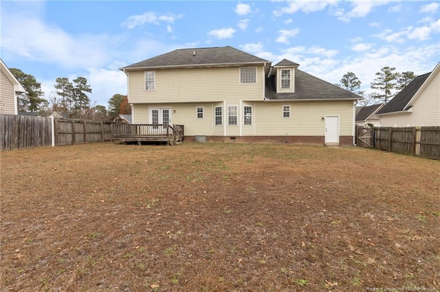 rear view of house featuring a deck
