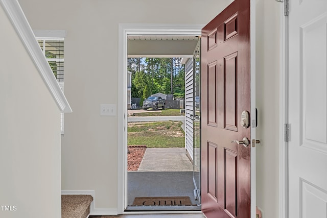 foyer entrance with baseboards
