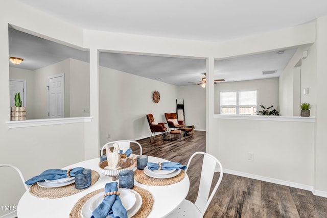 dining area featuring wood finished floors, ceiling fan, and baseboards