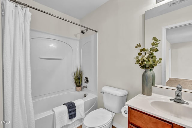 bathroom featuring shower / tub combo, vanity, and toilet
