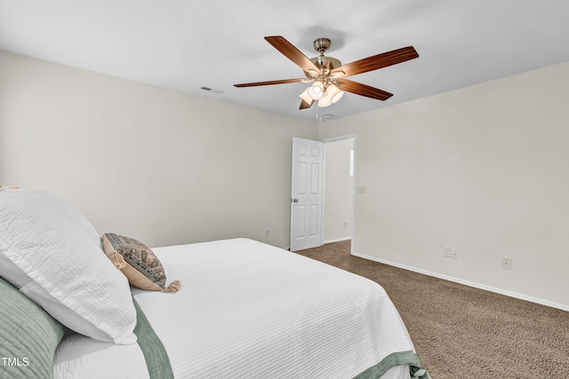 bedroom with carpet, baseboards, and a ceiling fan