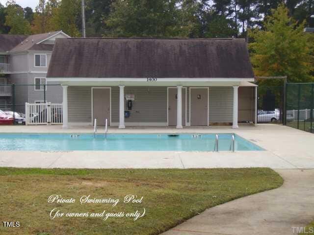 community pool featuring fence and a gate