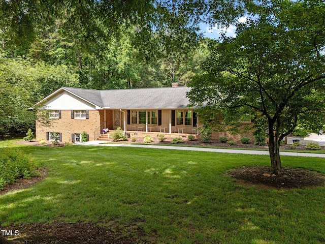 913 Milton Rd, Durham, NC 27712 - single story home featuring a porch, a front lawn, a chimney, brick siding, and roof with shingles