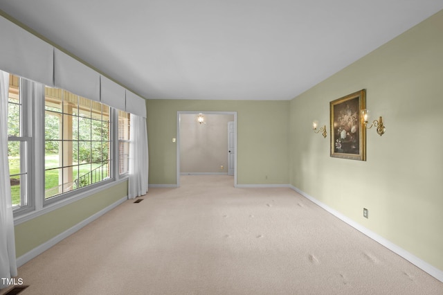 913 Milton Rd, Durham, NC 27712 - empty room with baseboards and light colored carpet