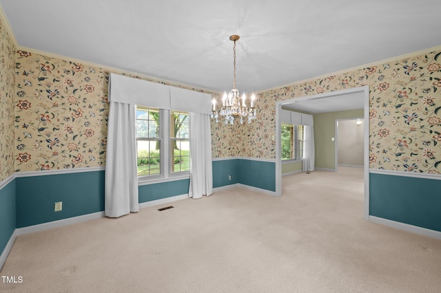 913 Milton Rd, Durham, NC 27712 - carpeted empty room with wallpapered walls, a chandelier, and ornamental molding