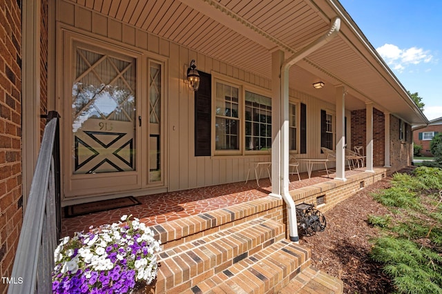 913 Milton Rd, Durham, NC 27712 - doorway to property with a porch and brick siding