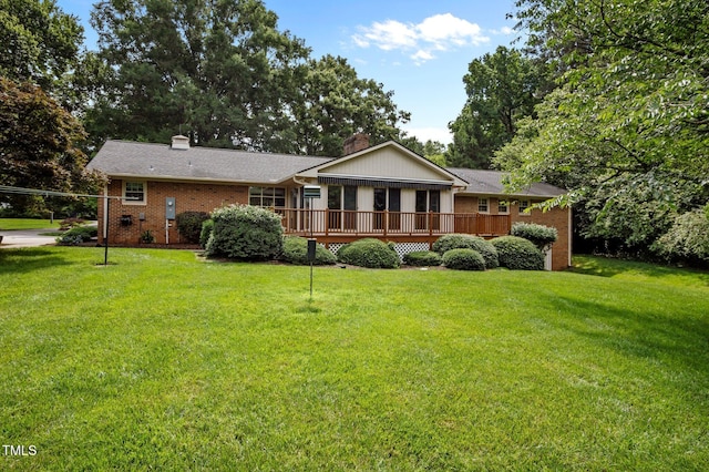 913 Milton Rd, Durham, NC 27712 - view of front of property featuring a wooden deck, a chimney, and a front yard