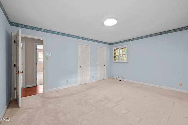 913 Milton Rd, Durham, NC 27712 - unfurnished bedroom with carpet flooring and baseboards