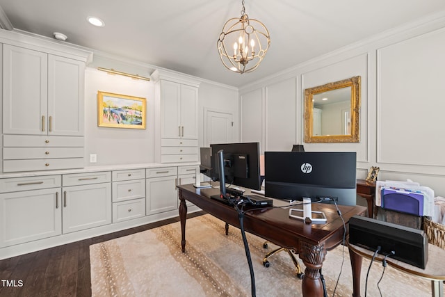 office area featuring a decorative wall, a chandelier, crown molding, dark wood finished floors, and recessed lighting