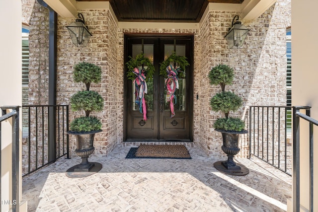 entrance to property with french doors and stone siding