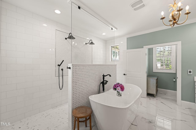 bathroom featuring plenty of natural light, a freestanding tub, walk in shower, baseboards, and crown molding