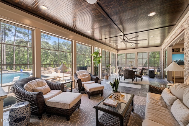 sunroom / solarium with outdoor lounge area, a ceiling fan, wooden ceiling, and outdoor dining space
