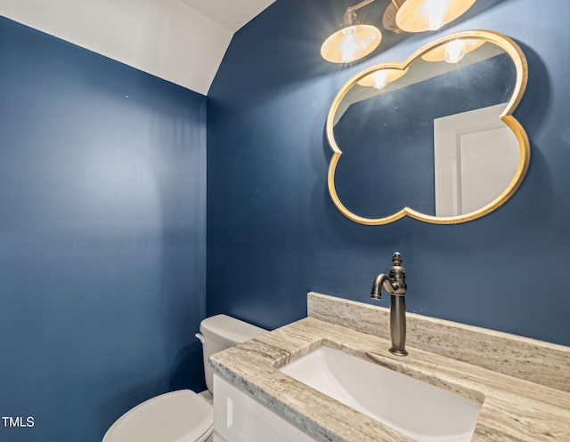bathroom with toilet and vanity
