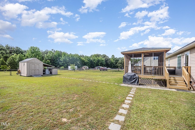 59 Long Grass Dr, Smithfield, NC 27577 - view of yard featuring a sunroom, a storage shed, a wooden deck, and an outbuilding