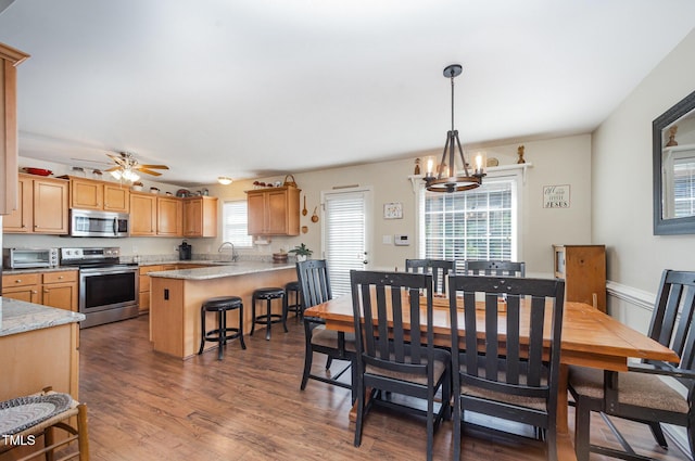 59 Long Grass Dr, Smithfield, NC 27577 - dining area with a chandelier, wood finished floors, and ceiling fan