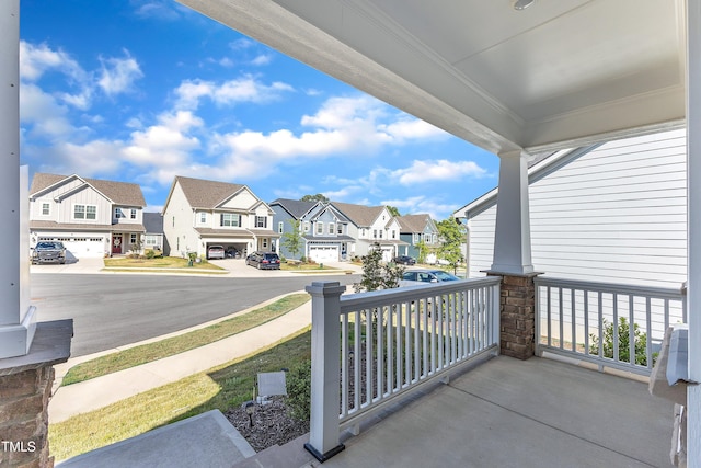 balcony with a residential view and a porch