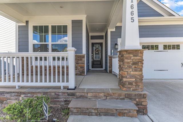 property entrance with a porch and stone siding