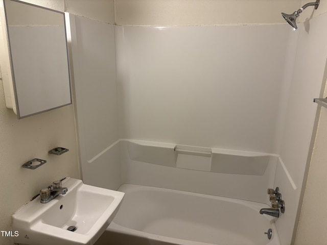 bathroom featuring a sink and  shower combination