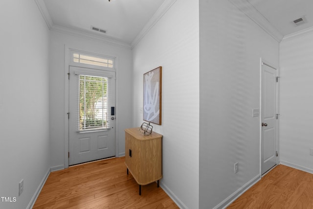 2057 Tanners Mill Dr, Durham, NC 27703 - doorway with light wood finished floors, crown molding, and baseboards