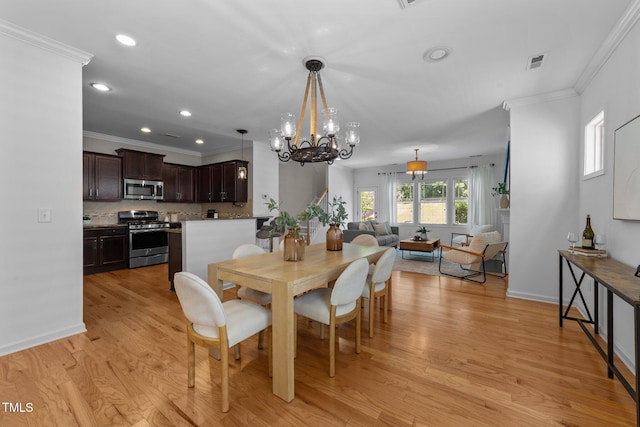 2057 Tanners Mill Dr, Durham, NC 27703 - dining space featuring a chandelier, crown molding, light wood-style flooring, recessed lighting, and baseboards