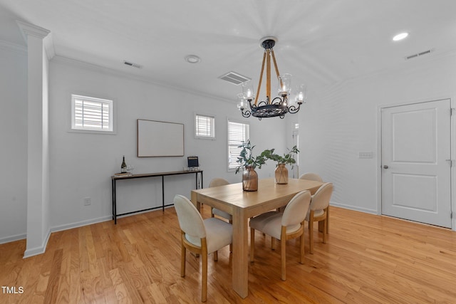 2057 Tanners Mill Dr, Durham, NC 27703 - dining area with crown molding, a chandelier, light wood-style floors, baseboards, and recessed lighting
