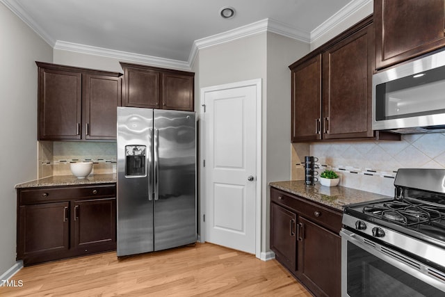 2057 Tanners Mill Dr, Durham, NC 27703 - kitchen featuring appliances with stainless steel finishes, stone countertops, tasteful backsplash, light wood-style flooring, and ornamental molding