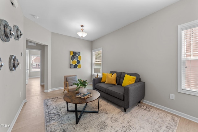 2057 Tanners Mill Dr, Durham, NC 27703 - living area featuring light wood-style floors and baseboards