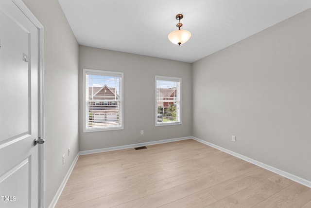 2057 Tanners Mill Dr, Durham, NC 27703 - empty room featuring light wood-style floors and baseboards