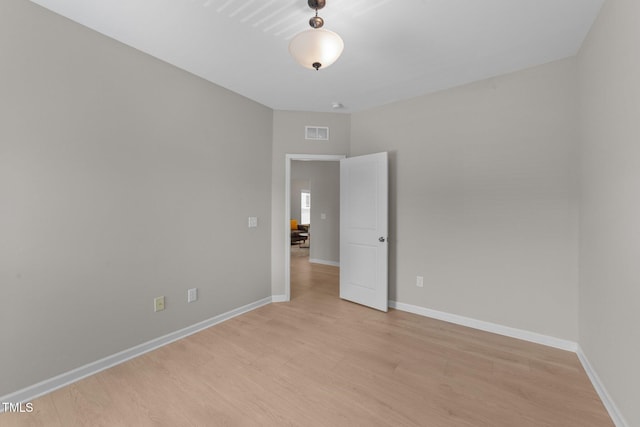 2057 Tanners Mill Dr, Durham, NC 27703 - empty room with light wood-type flooring and baseboards