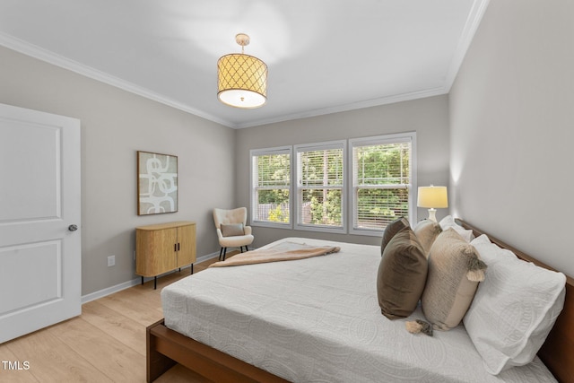 2057 Tanners Mill Dr, Durham, NC 27703 - bedroom with light wood-style floors, ornamental molding, and baseboards
