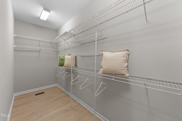2057 Tanners Mill Dr, Durham, NC 27703 - walk in closet with wood finished floors