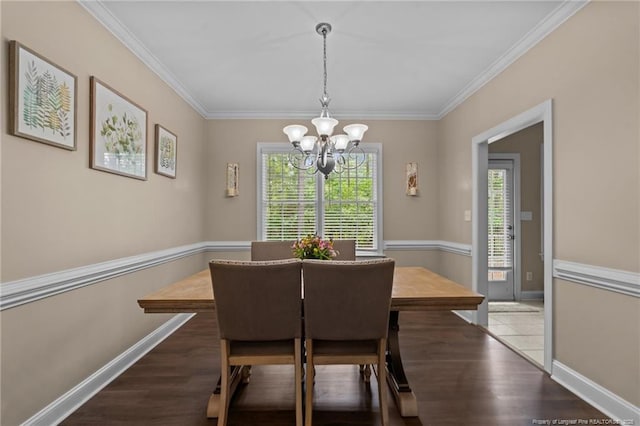 35 Shining Water Ln, Spring Lake, NC 28390 - dining area with a chandelier, wood finished floors, crown molding, and baseboards
