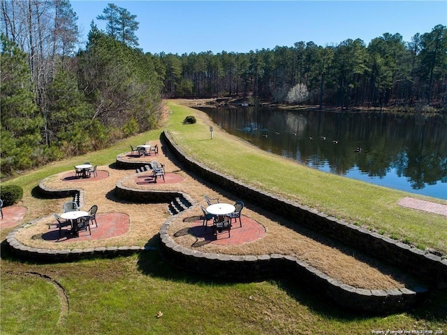 35 Shining Water Ln, Spring Lake, NC 28390 - view of property's community with a wooded view, a water view, a yard, and a patio