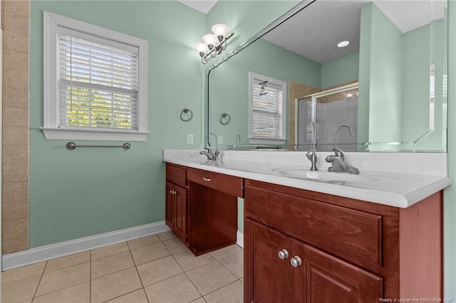full bathroom with a shower stall, tile patterned floors, plenty of natural light, and baseboards