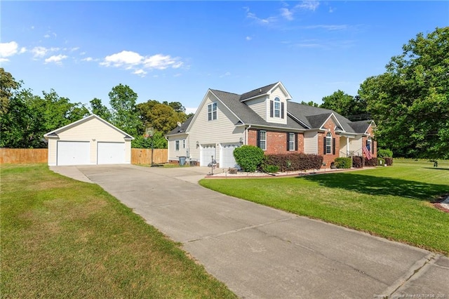 view of front of home with brick siding and a detached garage