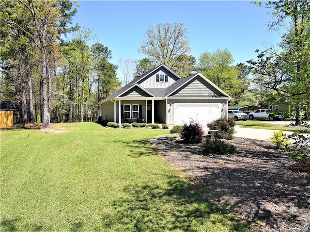 120 Will Lucas Rd, Linden, NC 28356 - view of front of property with driveway, an attached garage, and a front yard