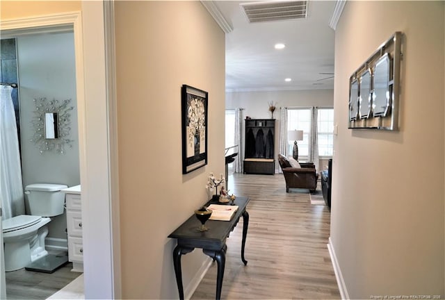 120 Will Lucas Rd, Linden, NC 28356 - hallway featuring crown molding, recessed lighting, wood finished floors, and baseboards