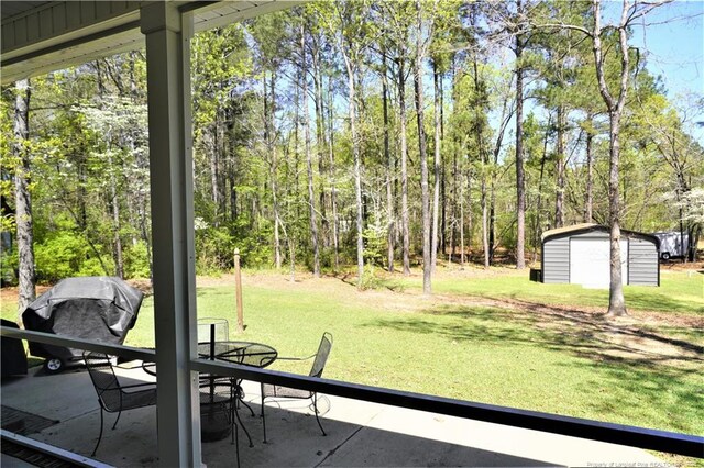 120 Will Lucas Rd, Linden, NC 28356 - view of green lawn with a shed, an outdoor structure, and a patio
