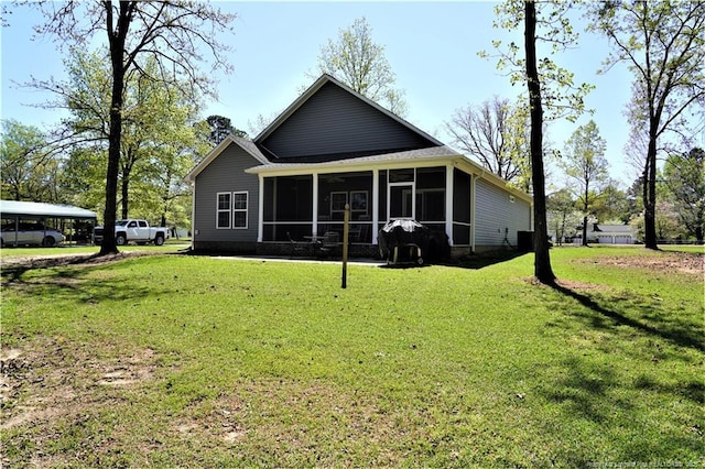 120 Will Lucas Rd, Linden, NC 28356 - rear view of house with a sunroom and a lawn
