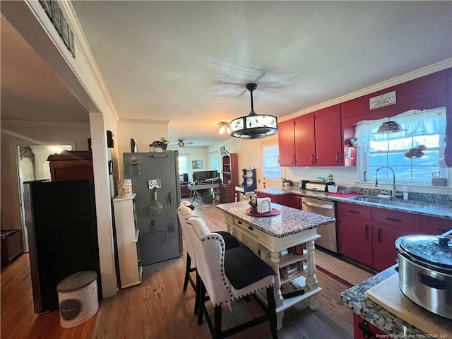 12558 Mcdougald Rd, Broadway, NC 27505 - kitchen featuring dishwasher, a sink, light wood-type flooring, ornamental molding, and red cabinets