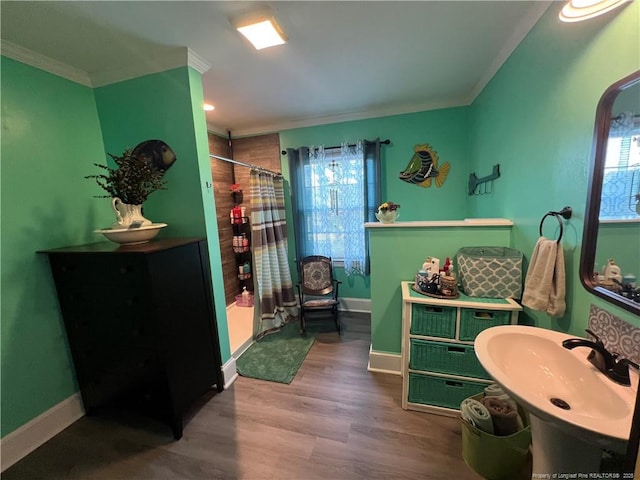 12558 Mcdougald Rd, Broadway, NC 27505 - full bathroom featuring a shower with shower curtain, ornamental molding, baseboards, a sink, and wood finished floors