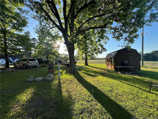 12558 Mcdougald Rd, Broadway, NC 27505 - view of grassy yard with a storage unit and an outdoor structure