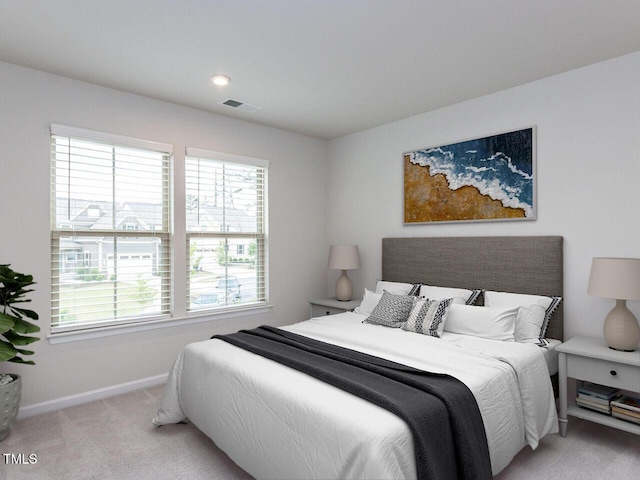 bedroom with carpet, baseboards, and multiple windows