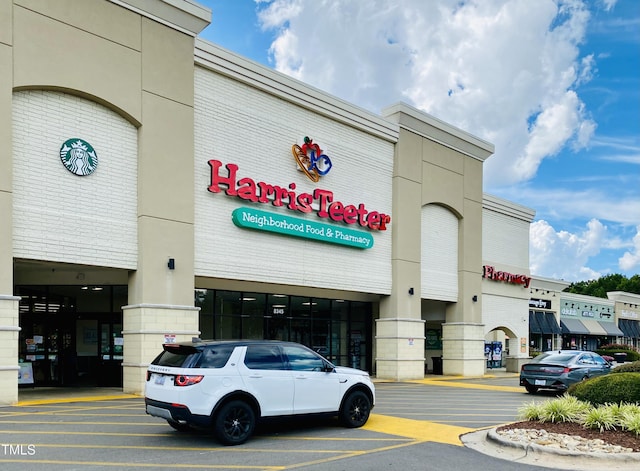 view of commercial location with uncovered parking