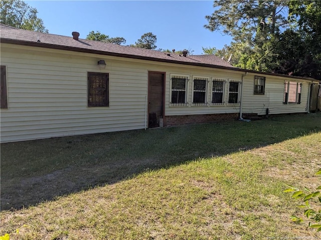 1829 Martindale Dr, Fayetteville, NC 28304 - back of house featuring a lawn