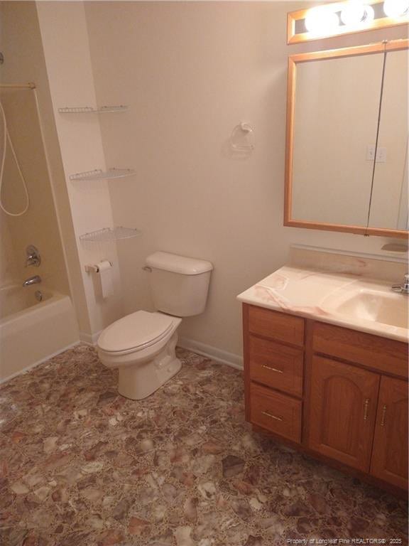 1829 Martindale Dr, Fayetteville, NC 28304 - full bathroom featuring vanity, toilet, shower / bath combination, and baseboards