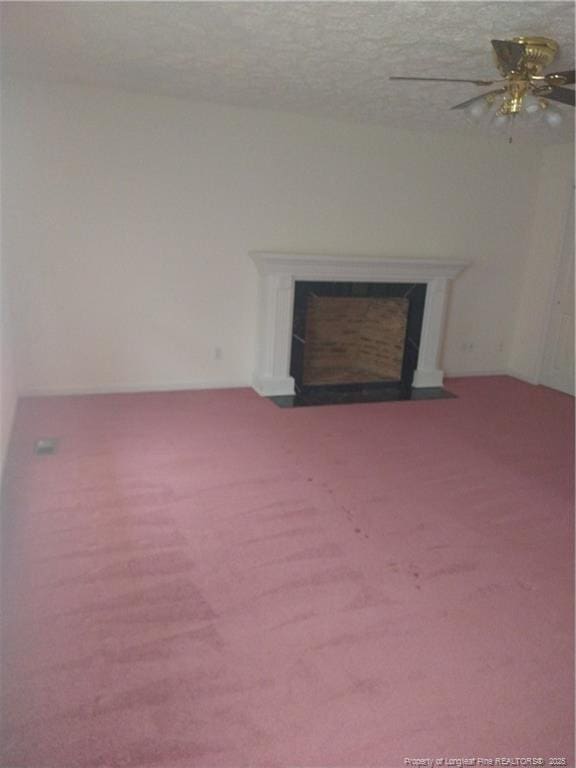1829 Martindale Dr, Fayetteville, NC 28304 - unfurnished living room with a fireplace with flush hearth, carpet, and a ceiling fan